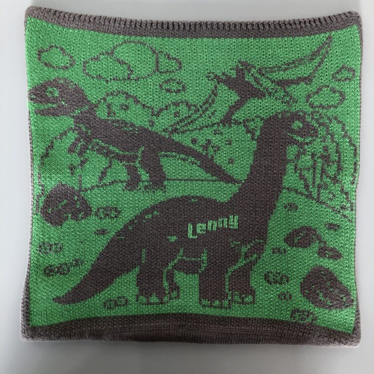 Putetrekk i grønn med dinosaurier